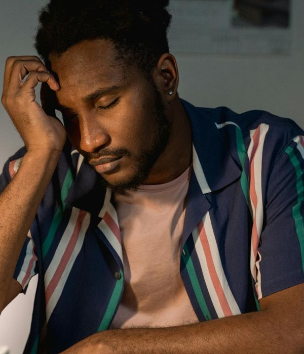 Man architect professional portrait with blueprints in modern office