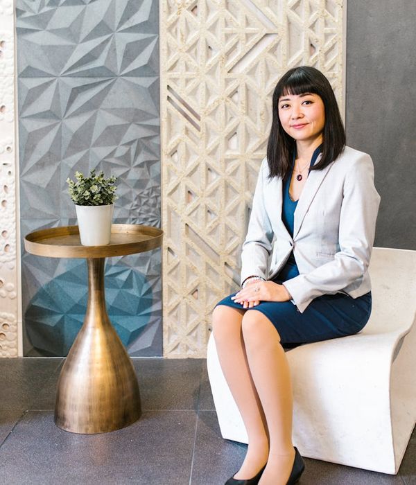 Woman designer professional smiling portrait in elegant office environment